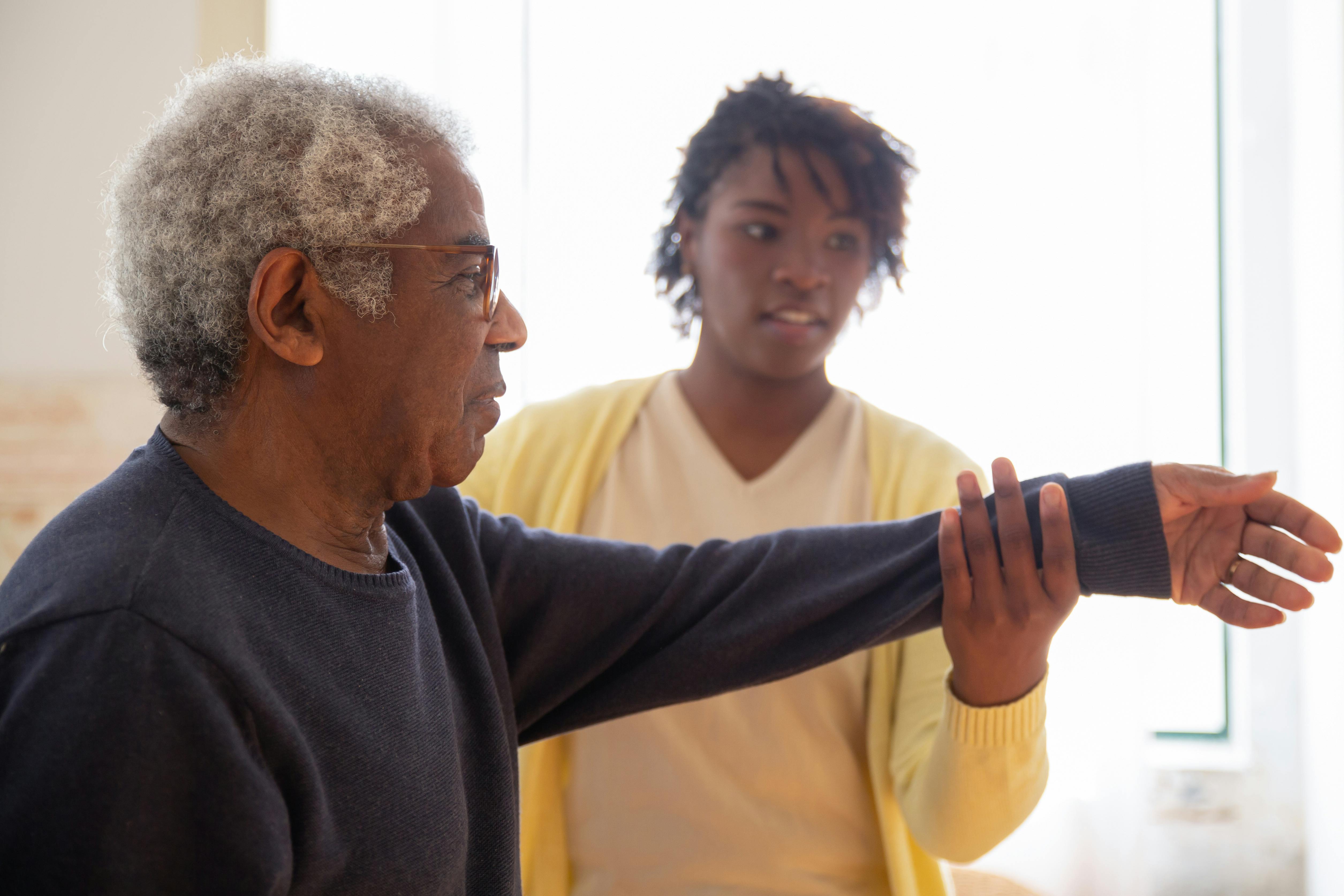 Caregiver supporting an elderly resident